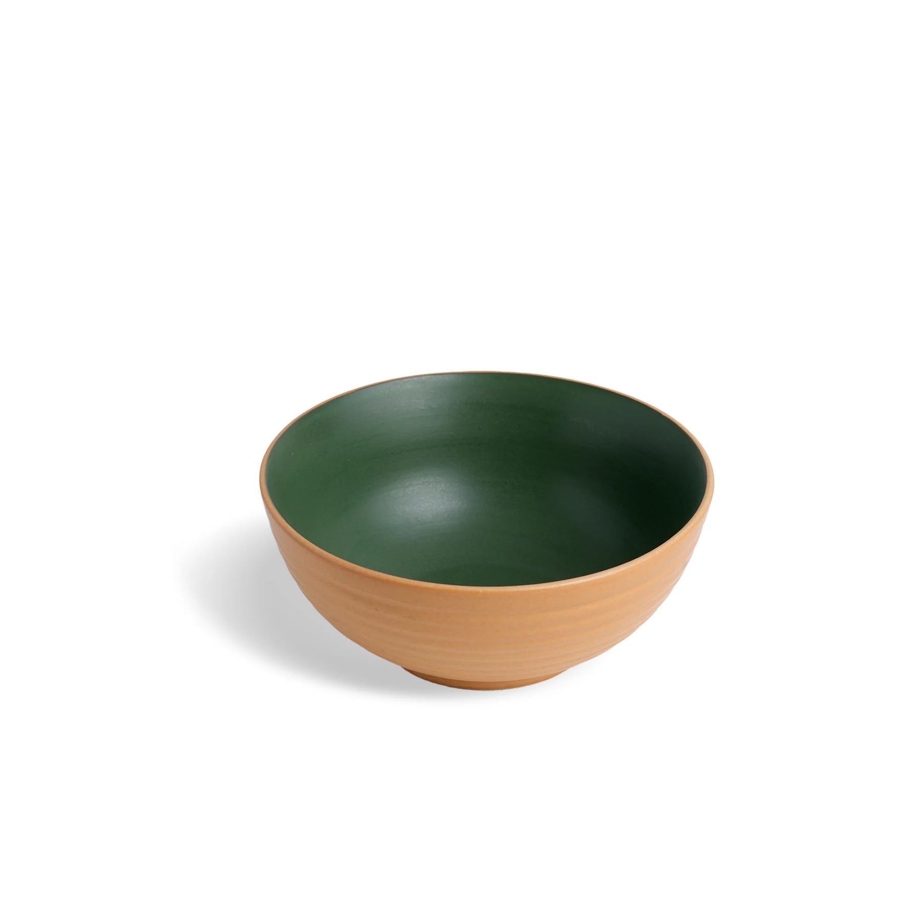 Green and brown ceramic bowl on a white background