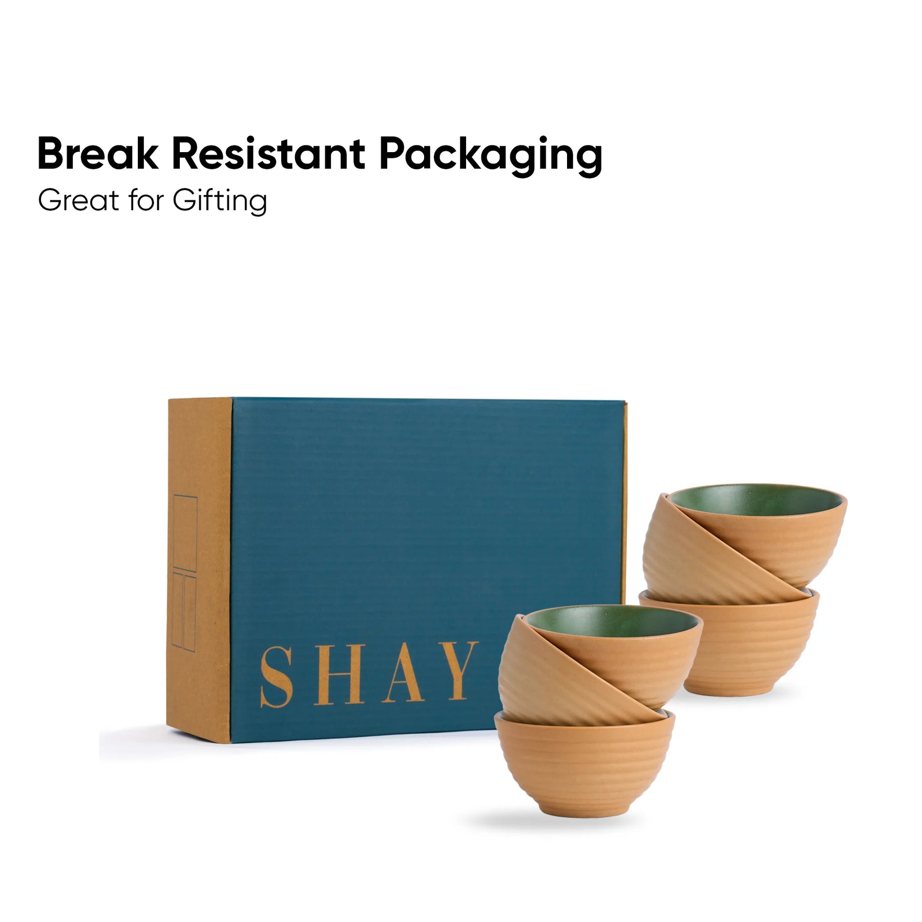 Set of wooden bowls with green interior and 'SHAY' branded box on a white background