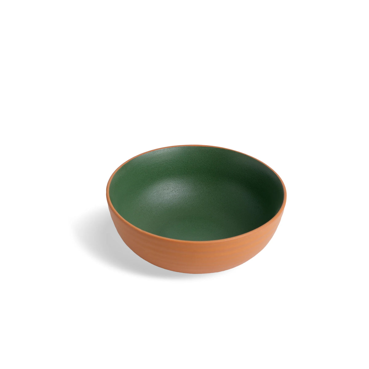 Green and brown ceramic bowl on a white background