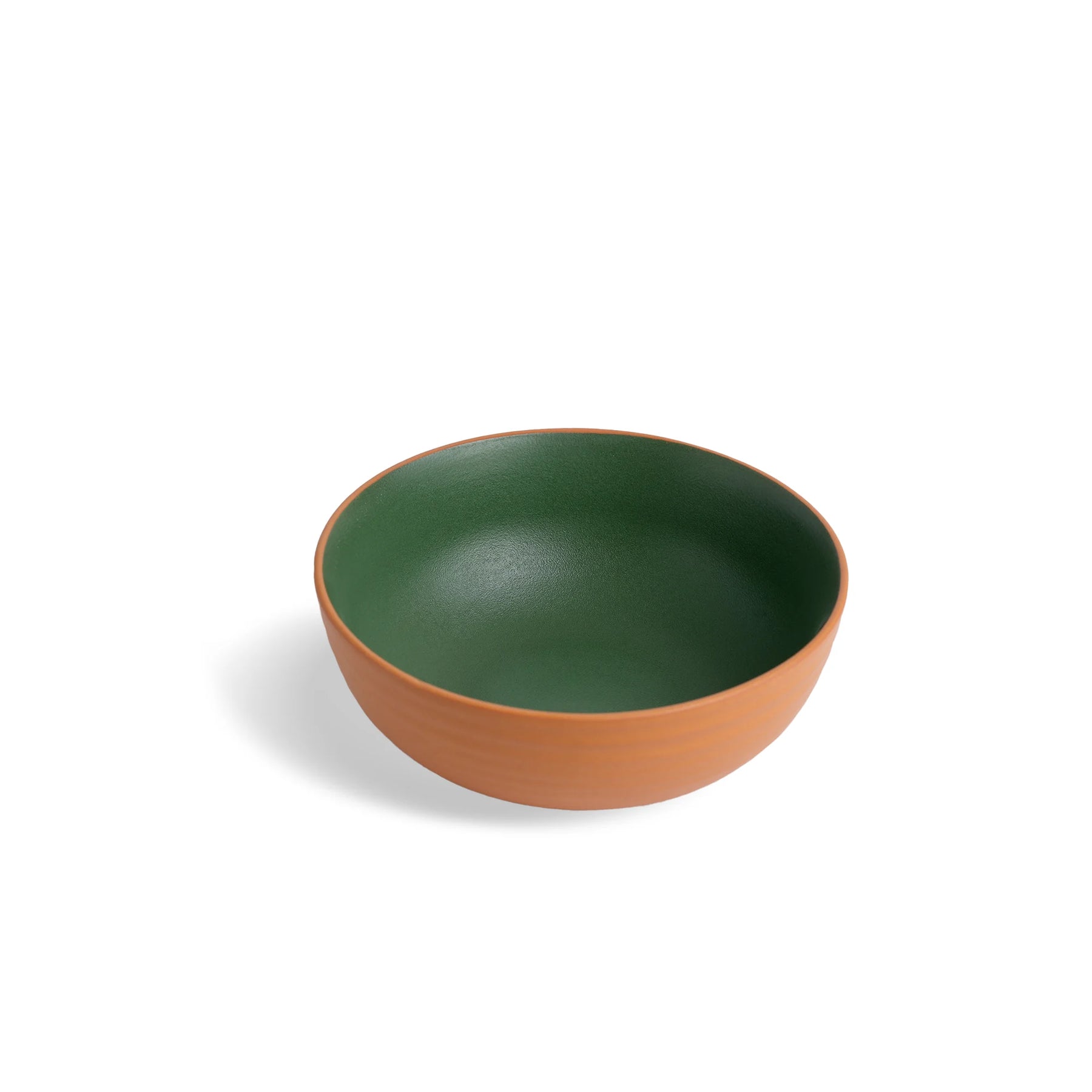 Green and brown ceramic bowl on a white background