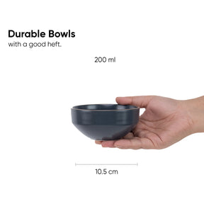 Hand holding a dark gray bowl with text indicating durability and capacity.