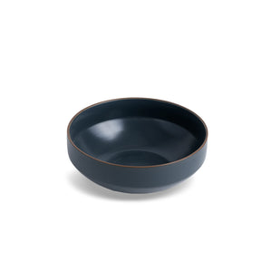 Dark blue ceramic bowl on a white background