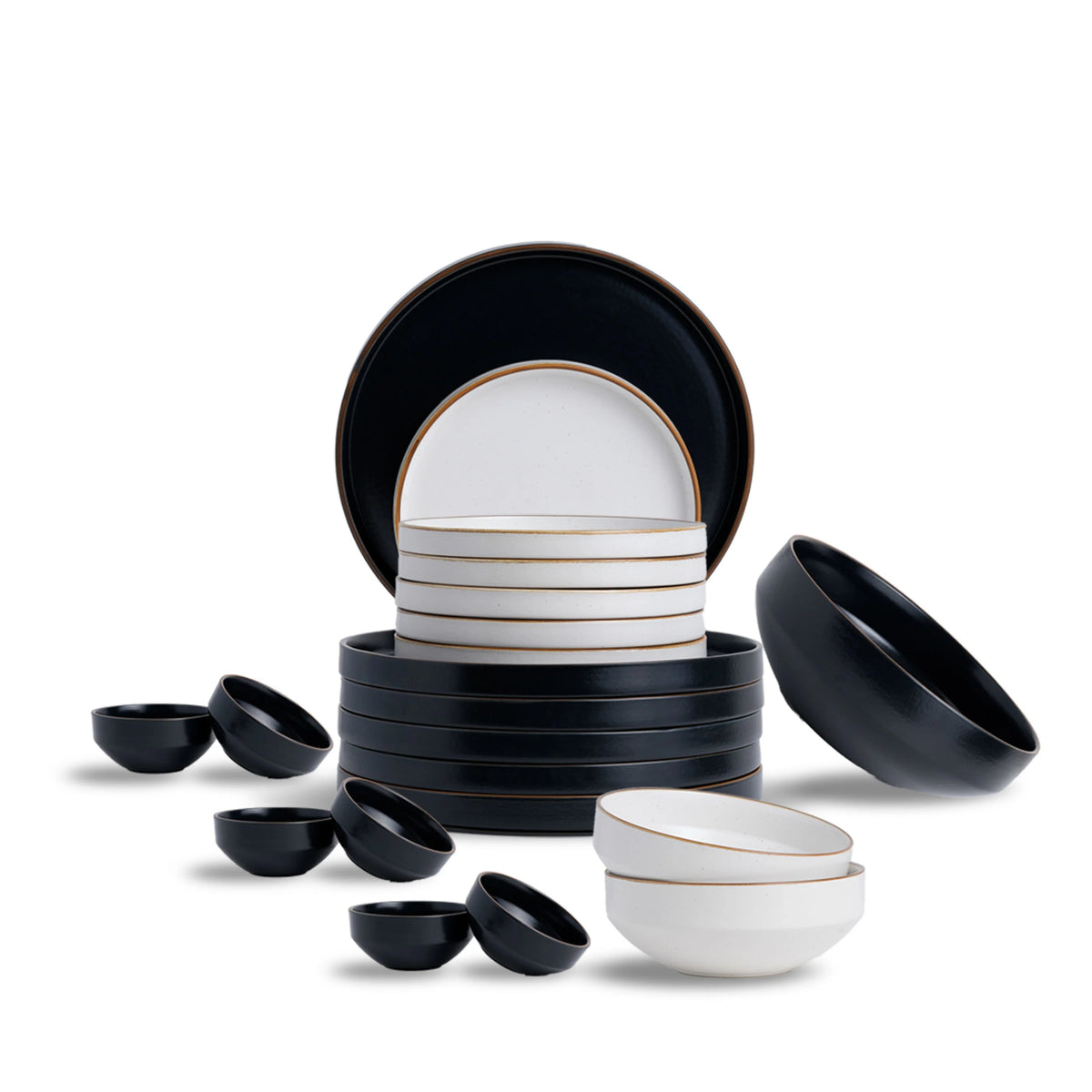 Set of black and white ceramic dishes on a white background