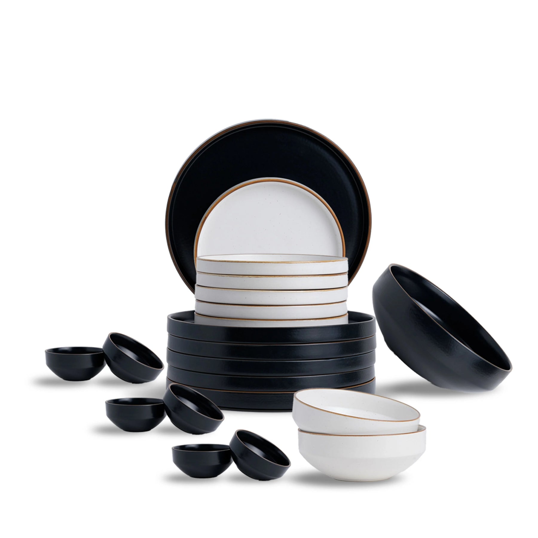 Set of black and white ceramic dishes on a white background
