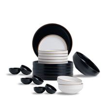 Set of black and white ceramic dishes on a white background