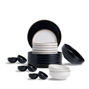 Set of black and white ceramic dishes on a white background