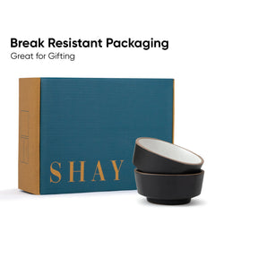 Set of black bowls with 'SHAY' branding on a blue box, emphasizing break-resistant packaging.