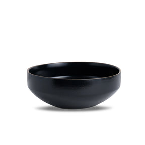 Black ceramic bowl on a white background