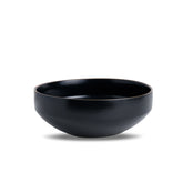 Black ceramic bowl on a white background