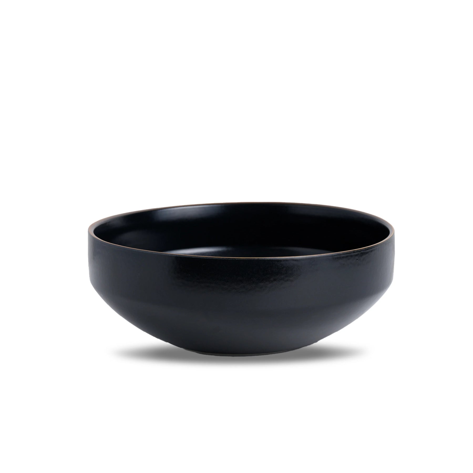Black ceramic bowl on a white background