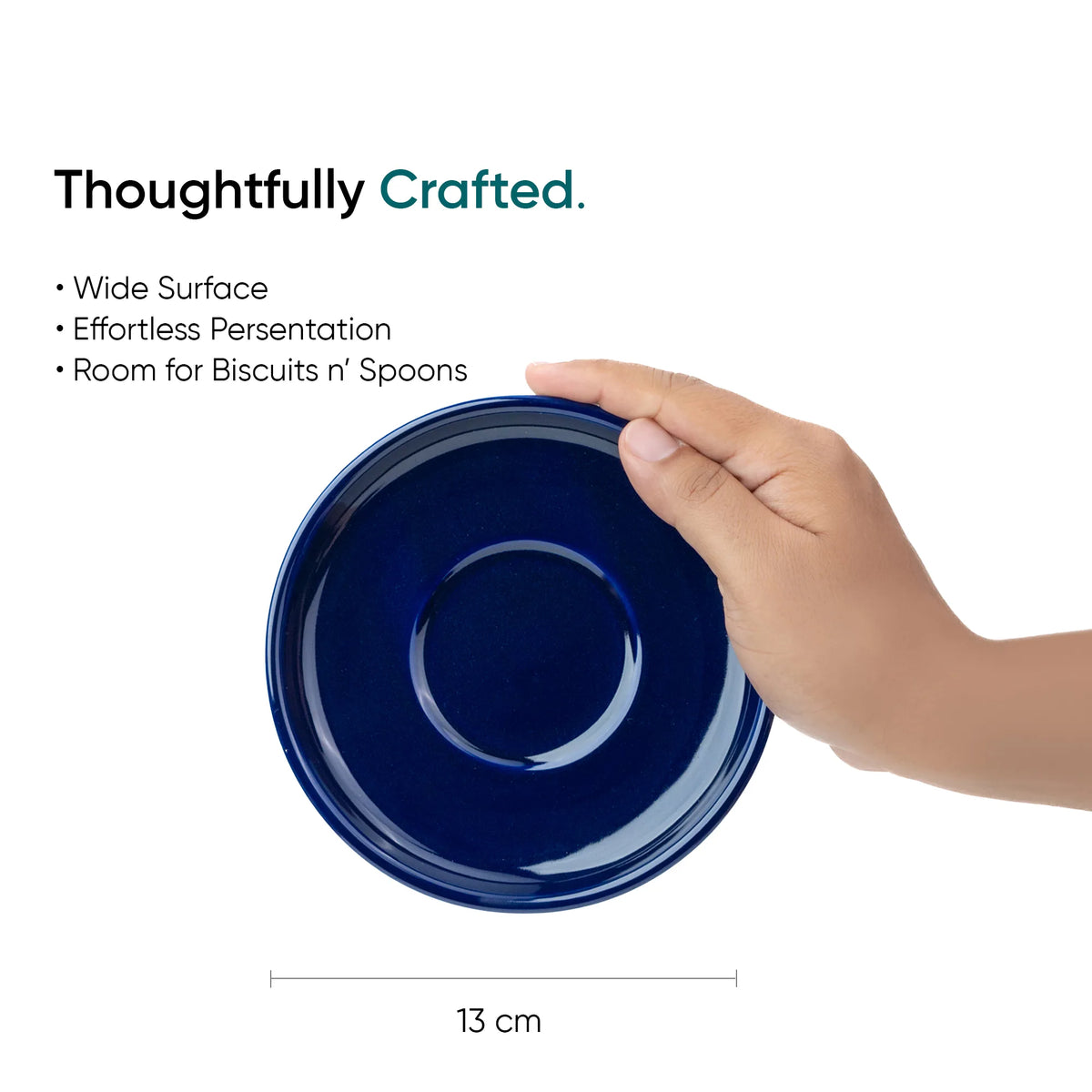 Navy blue plate held by a hand with text about its features on a white background