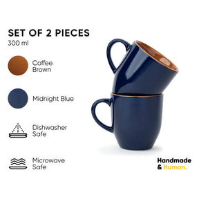 Set of two blue mugs with brown interior, labeled 'Coffee Brown' and 'Midnight Blue', on a white background.