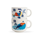 Two stacked mugs with illustrated designs of people sitting and using devices on a white background