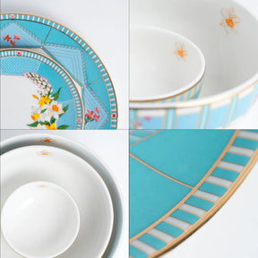 Set of ceramic plates with floral and geometric designs on a white background
