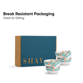 Set of ceramic bowls with 'SHAY' branding next to a teal box, labeled 'Break Resistant Packaging'.