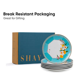 Set of decorative plates with floral design on a 'SHAY' branded box, emphasizing break-resistant packaging.