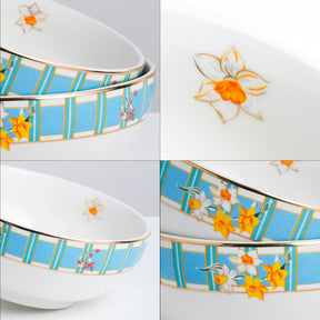 Set of ceramic bowls with floral designs on a white background