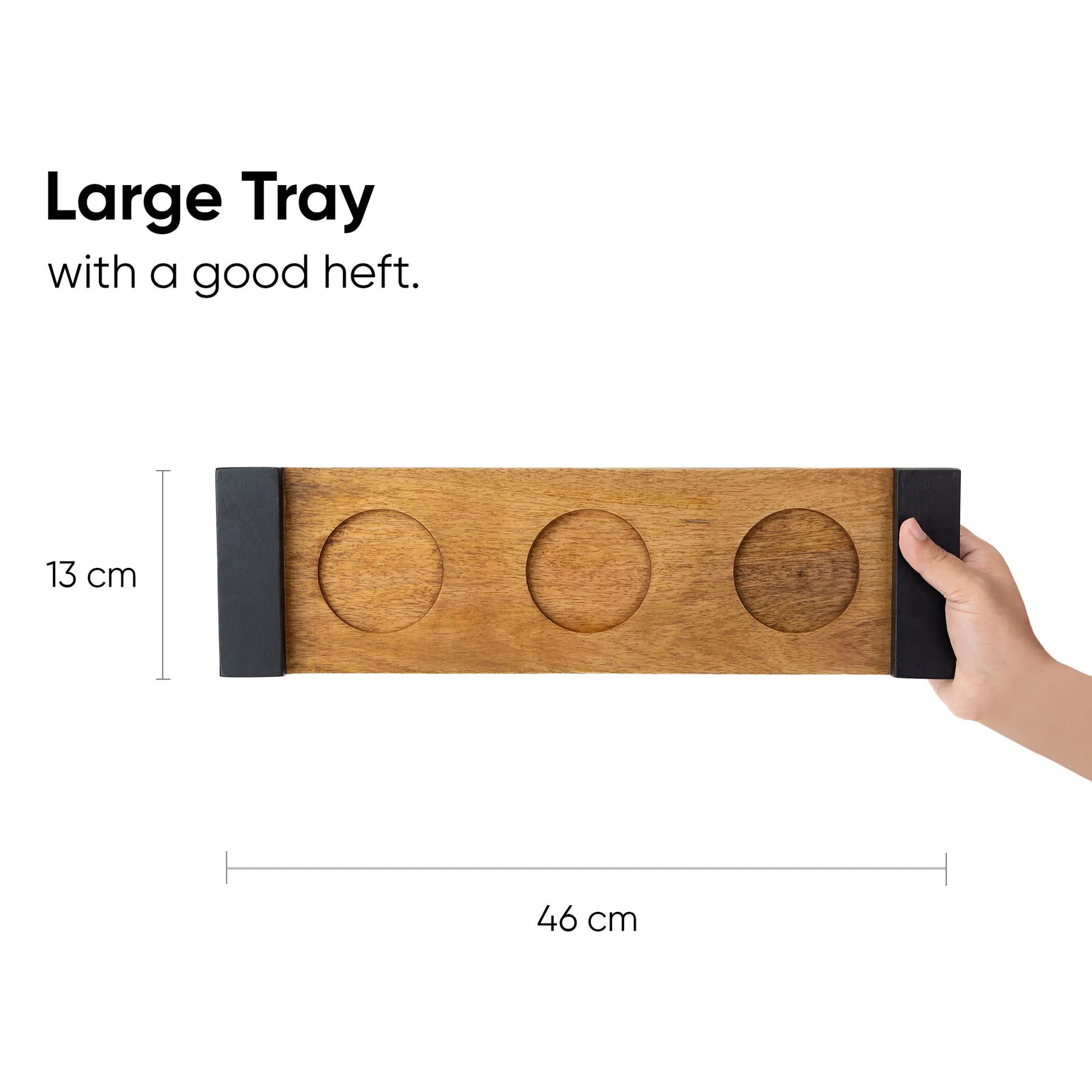 Wooden tray with dimensions and a hand holding it on a white background