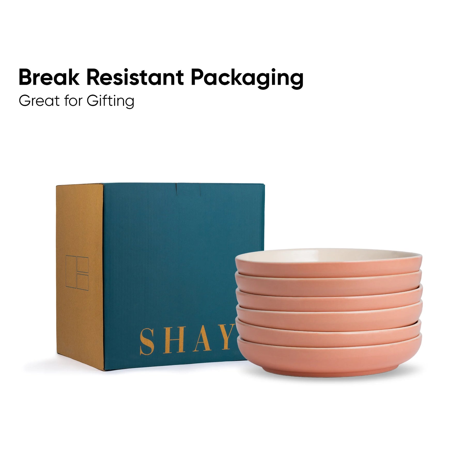 Stack of pink bowls with a teal box labeled 'SHAY' on a white background.