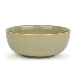 Green ceramic bowl on a white background