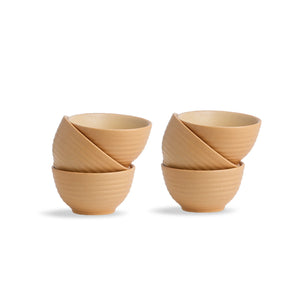 Set of four woven wooden bowls on a white background