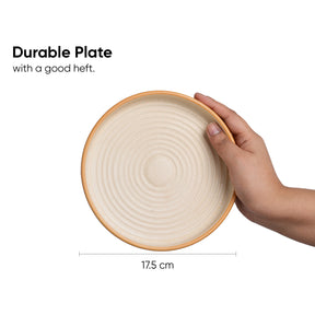 Hand holding a beige ceramic plate with text indicating 'Durable Plate with a good heft' and a measurement of 17.5 cm.