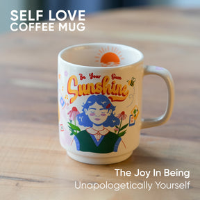 Coffee mug with 'Be Your Own Sunshine' design on a wooden surface