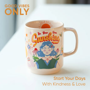 Mug with a colorful design and text 'Be Your Own Sunshine' on a light background