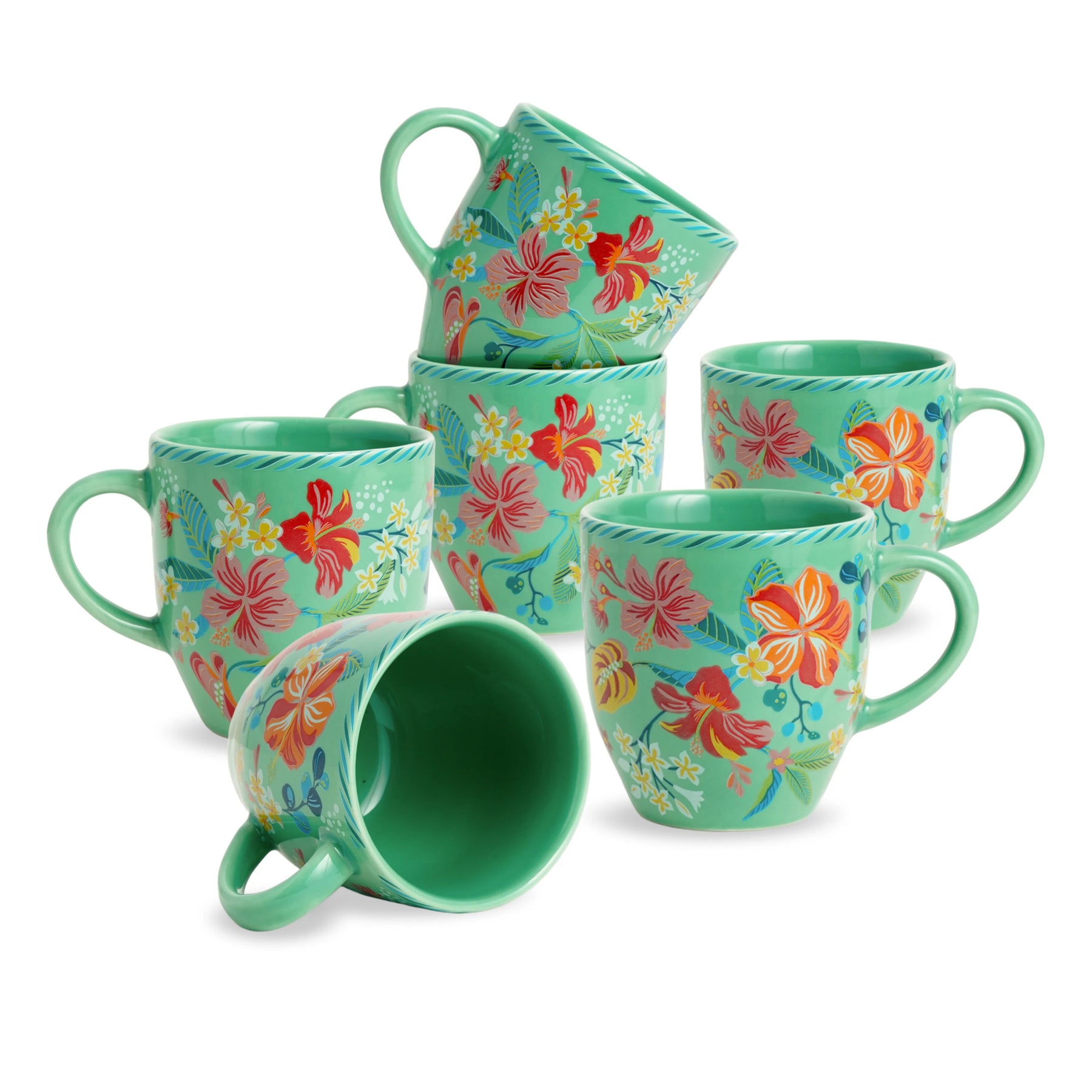 Set of green mugs with floral patterns on a white background