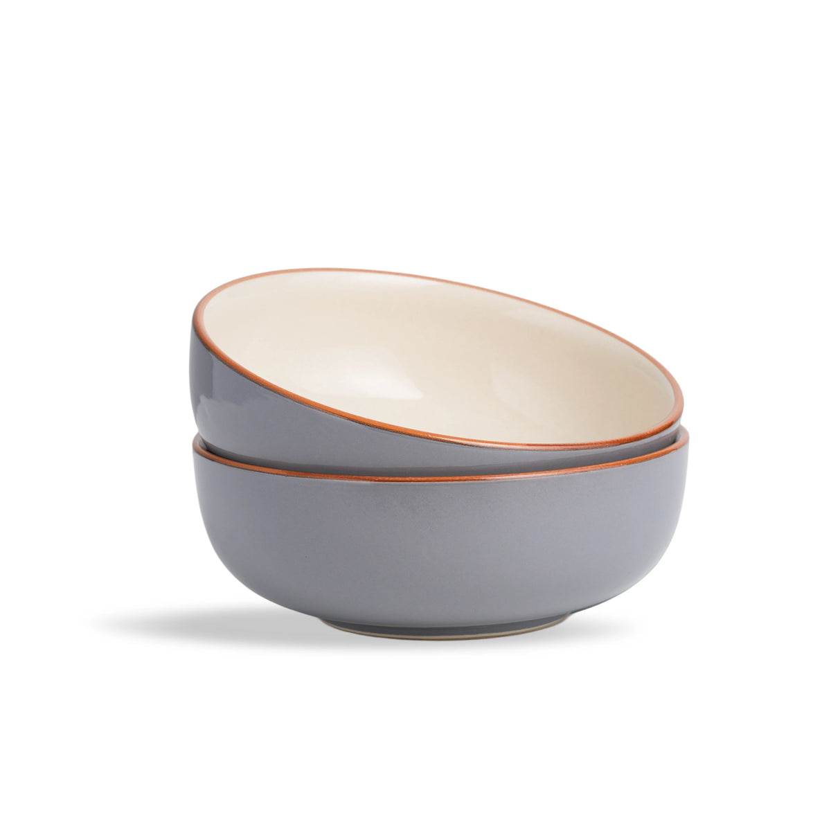 Two gray ceramic bowls with orange rims stacked on a white background