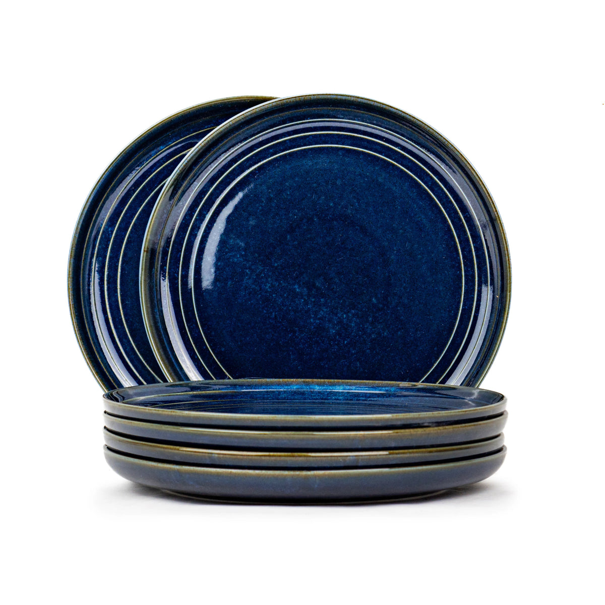 Set of blue ceramic plates on a white background