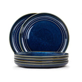 Set of blue ceramic plates on a white background