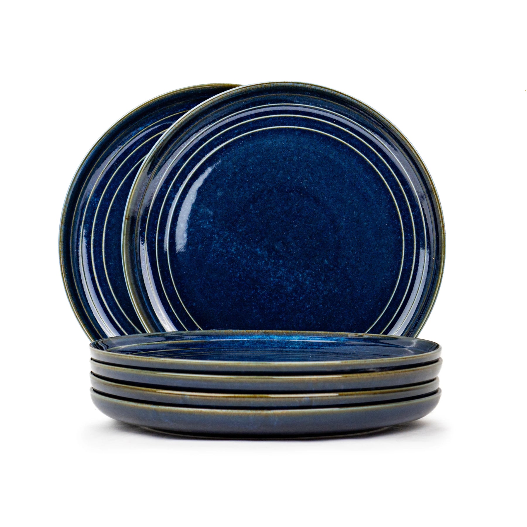 Set of blue ceramic plates on a white background