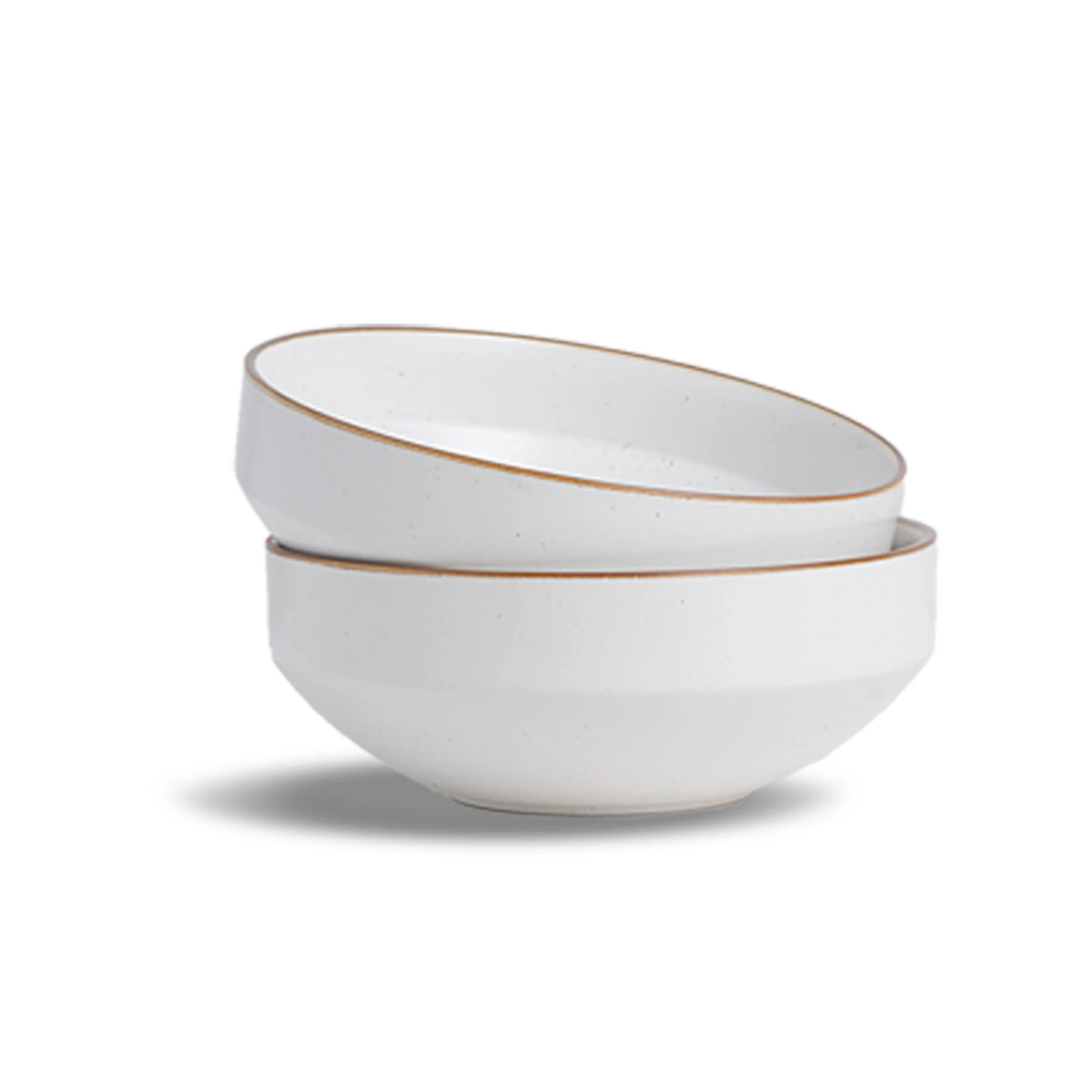 Two white ceramic bowls with gold rims stacked on a white background
