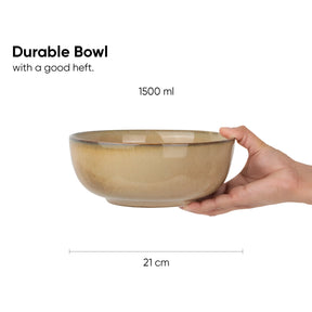 Hand holding a durable bowl with measurements on a white background