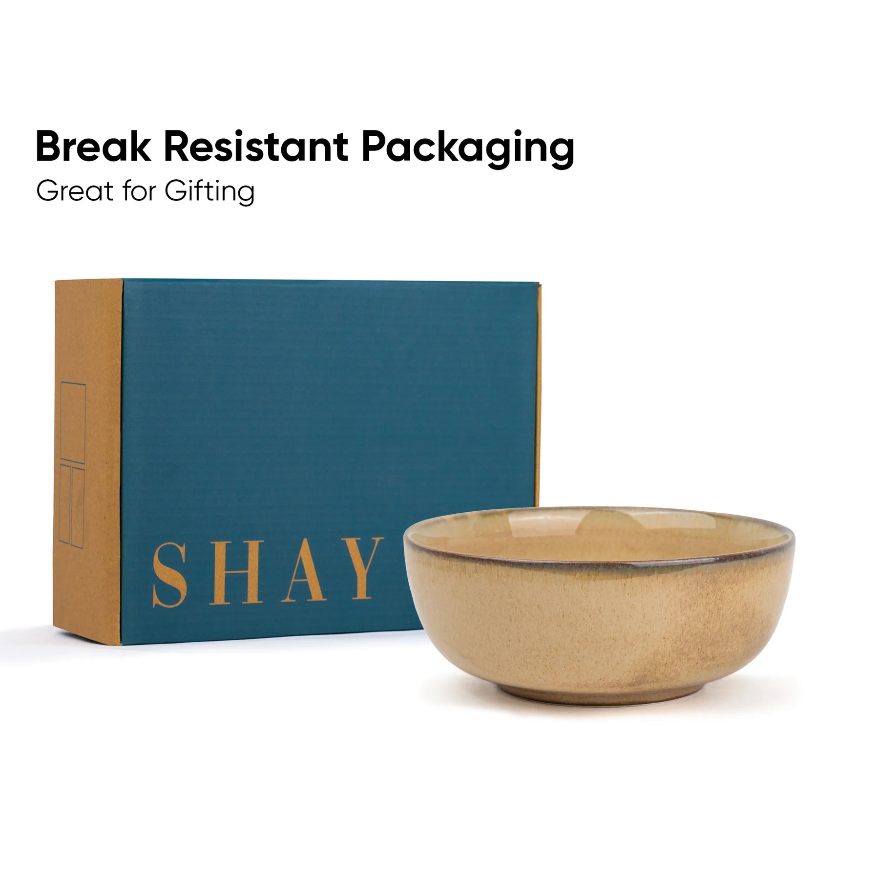Ceramic bowl in front of a 'SHAY' branded box with text about break-resistant packaging.