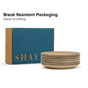 Stack of ceramic bowls with a 'SHAY' branded box on a white background