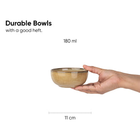 Hand holding a ceramic bowl with dimensions and text on a white background