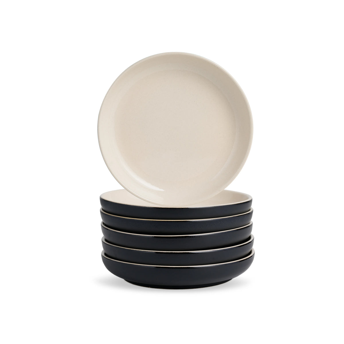 Set of four ceramic bowls with a white top bowl and black bottom bowls on a white background