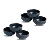 Set of five dark blue ceramic bowls on a white background