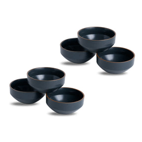 Set of five dark blue ceramic bowls on a white background