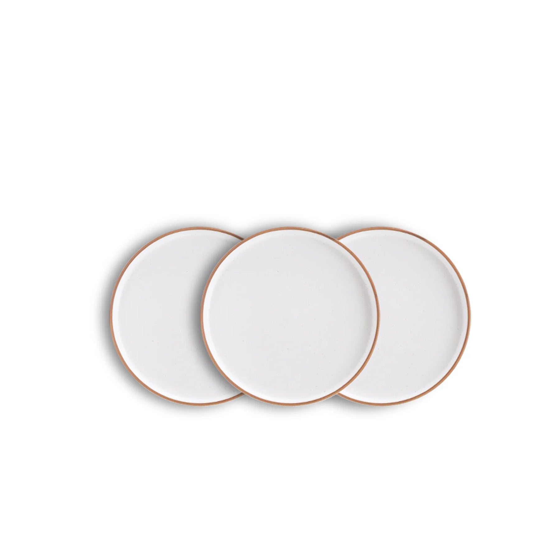 Three white plates with gold rims on a white background