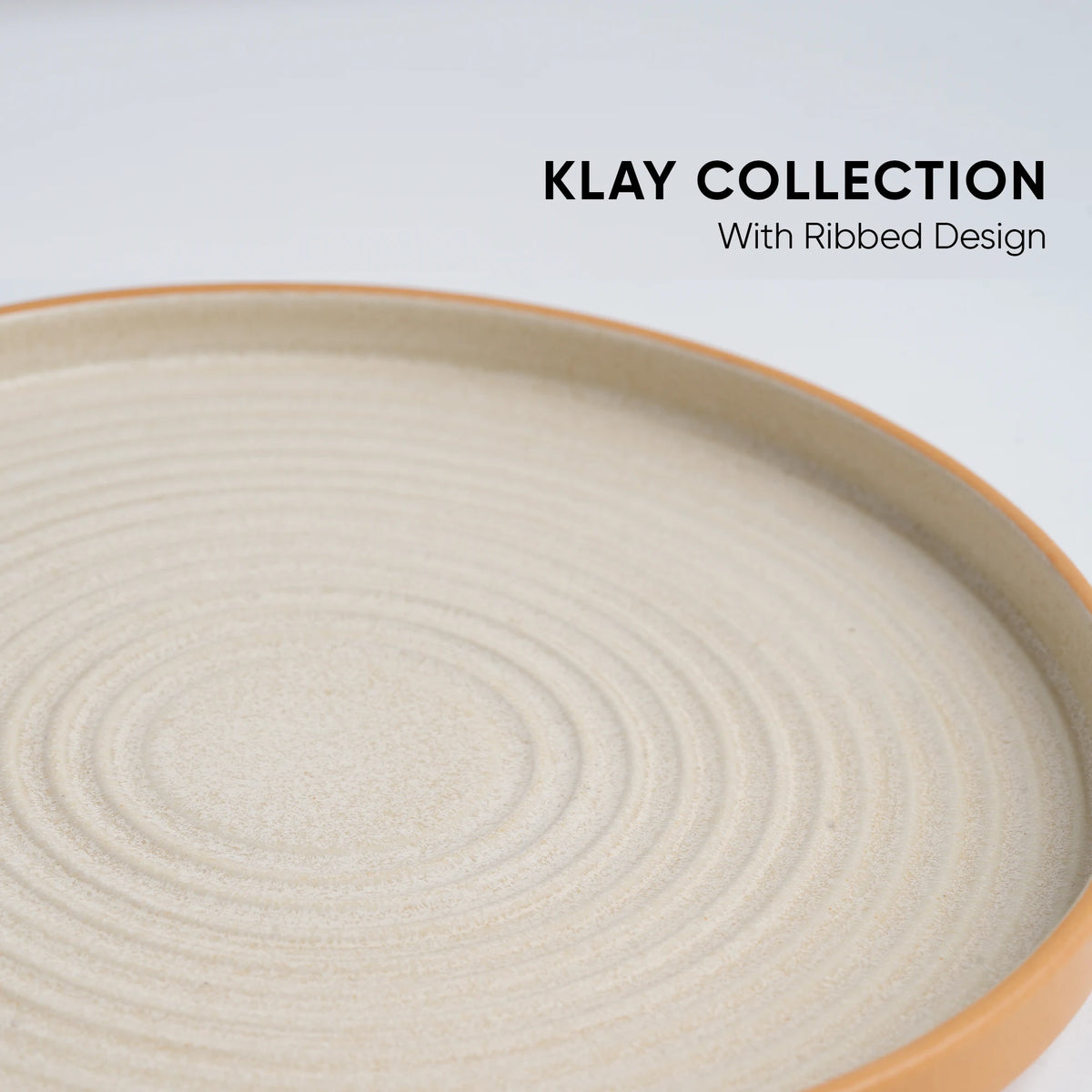 Beige ceramic plate with ribbed design on a light gray background, featuring 'Klay Collection' text.