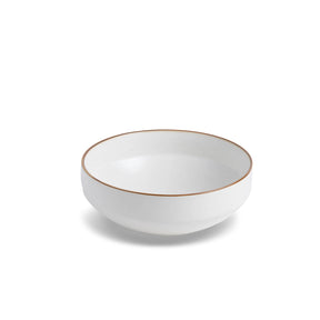White ceramic bowl with a thin brown rim on a white background