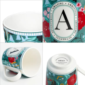 Colorful mug with decorative design and 'A' emblem, surrounded by close-up images of the mug and packaging.