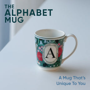 Mug with decorative design and letter 'A' on a light background