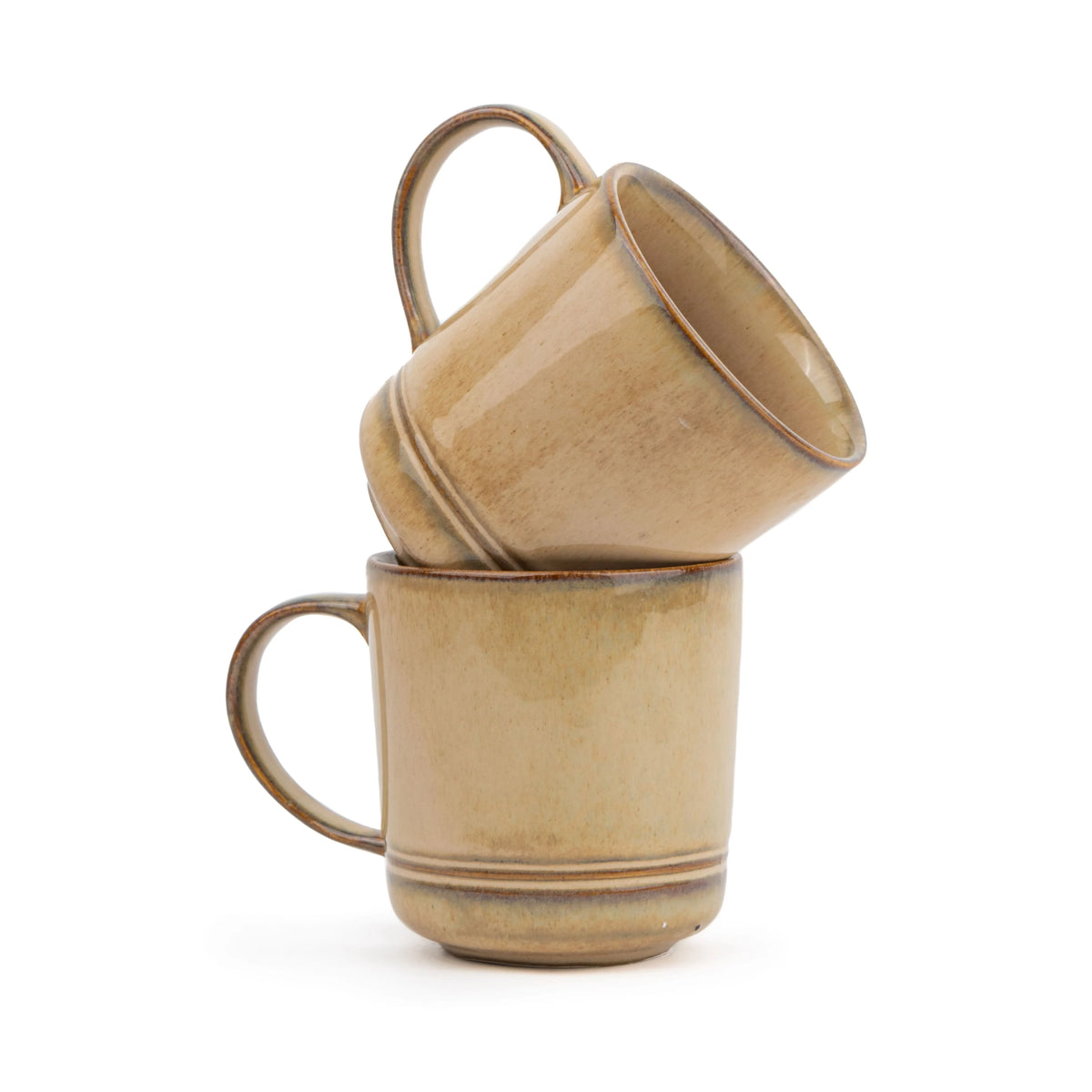 Two beige ceramic mugs stacked on a white background