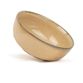 Beige ceramic bowl on a white background