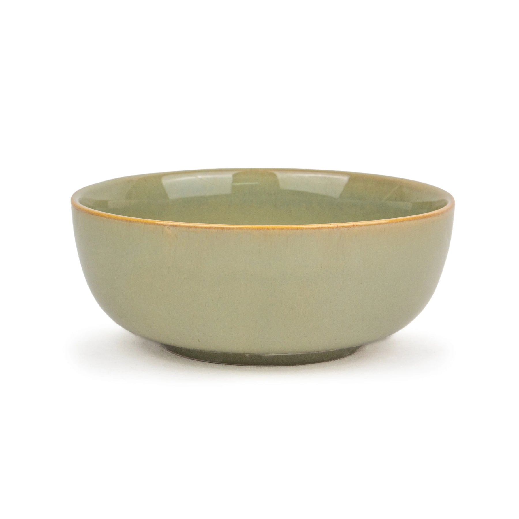 Green ceramic bowl on a white background