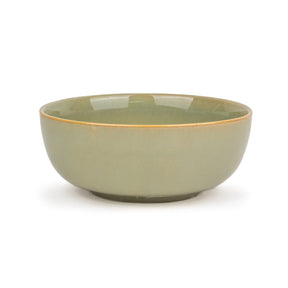 Green ceramic bowl on a white background